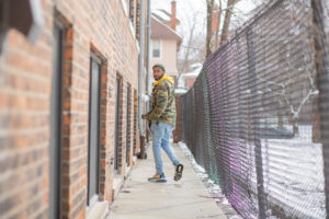 A man walks alongside his apartment building in Detroit